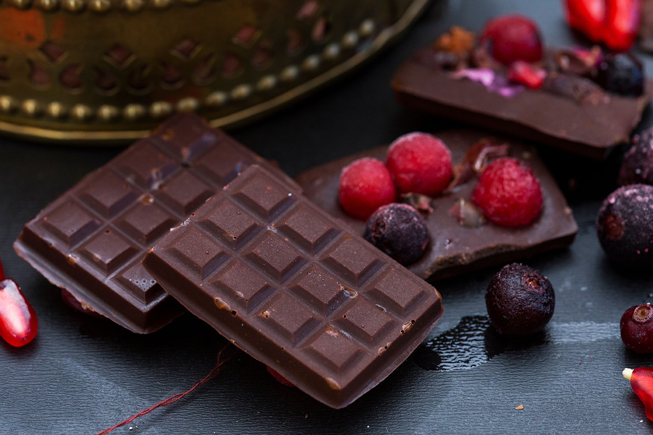 A closeup shot of delicious raw vegan chocolate with dried berries