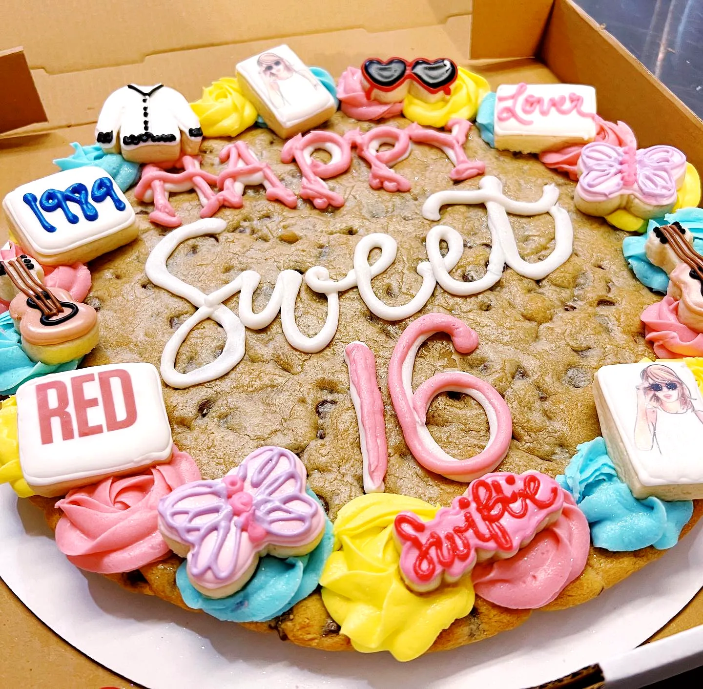 Adorable 16th Birthday Cake Design with Colorful Decorations and Fun Elements