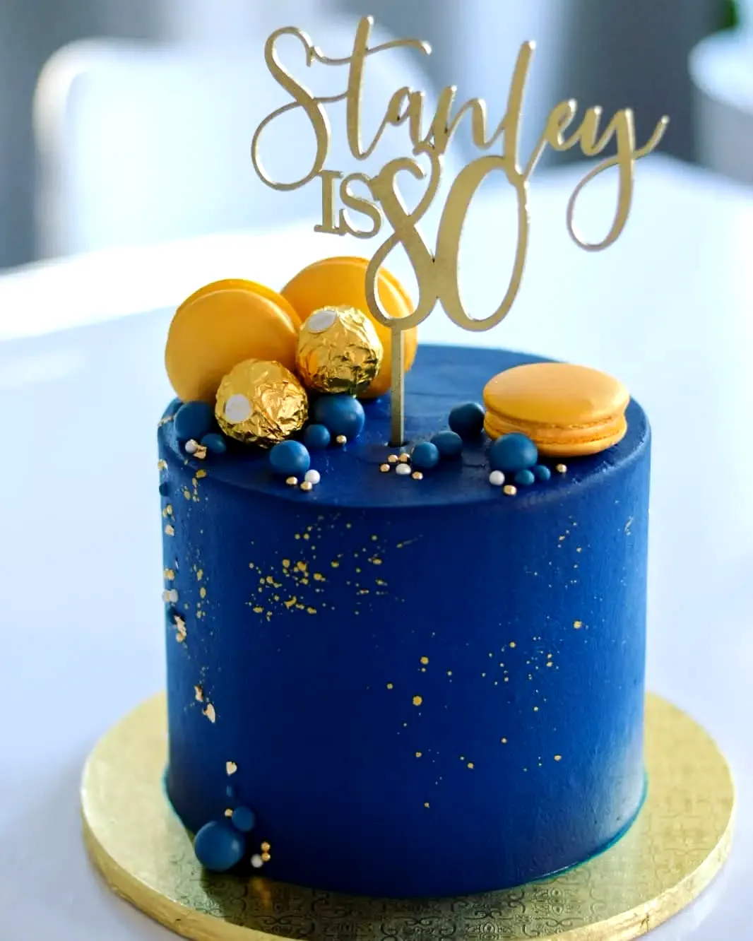 Adorable 80th Birthday Cake with Blue Buttercream and Gold Accents