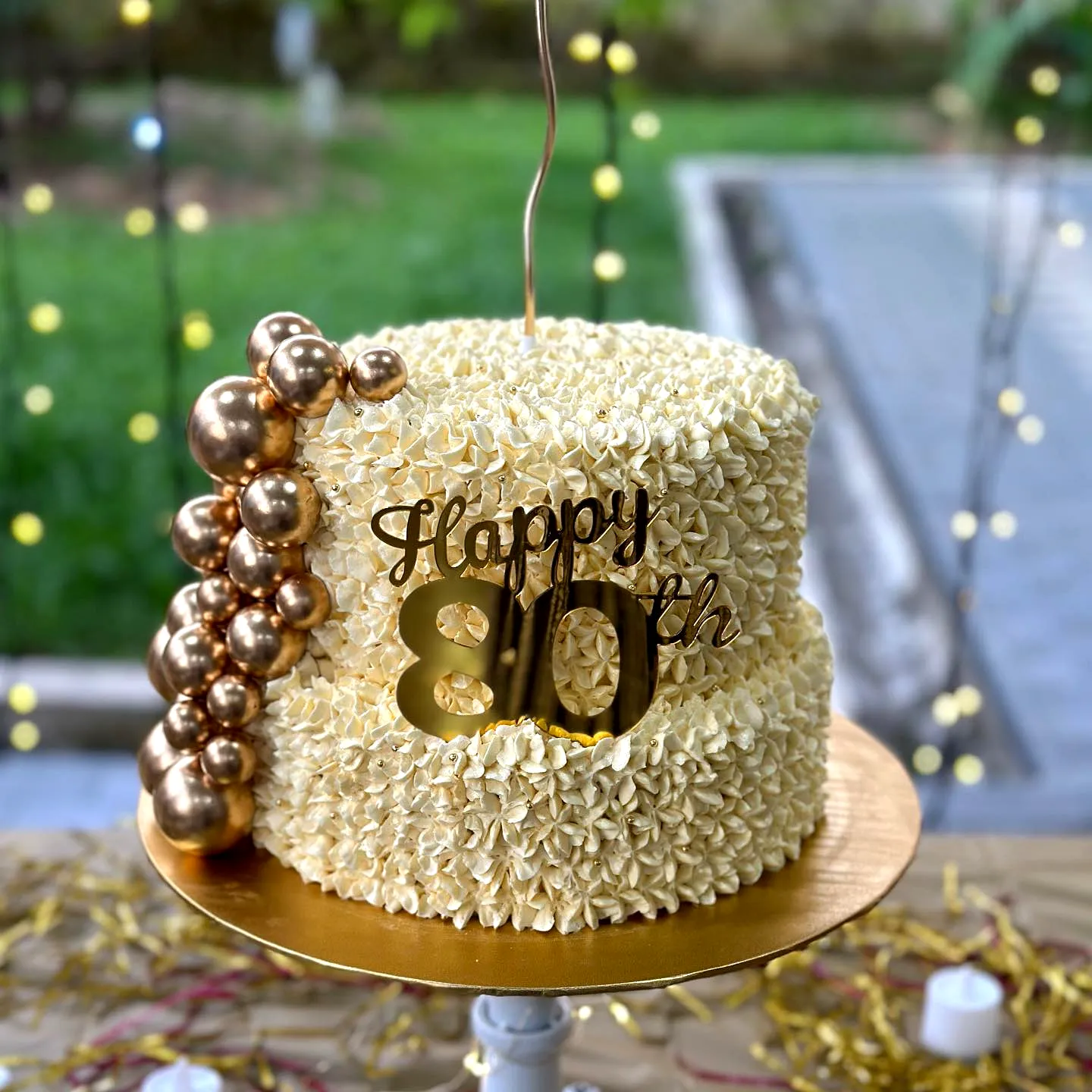Adorable 80th Birthday Cake with Ruffled Yellow Frosting and Golden Accents