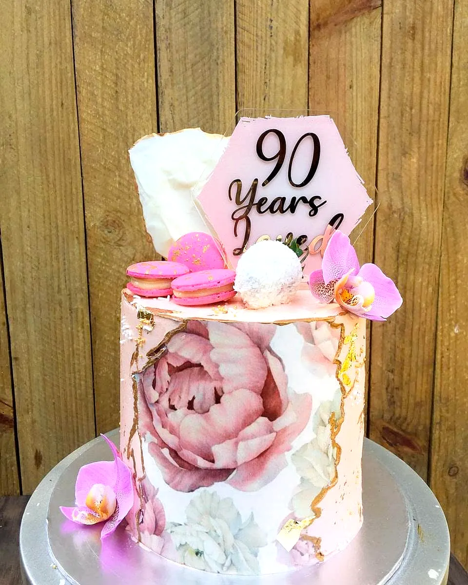 Adorable 90th Birthday Cake With Pink Buttercream and Elegant Floral Accents