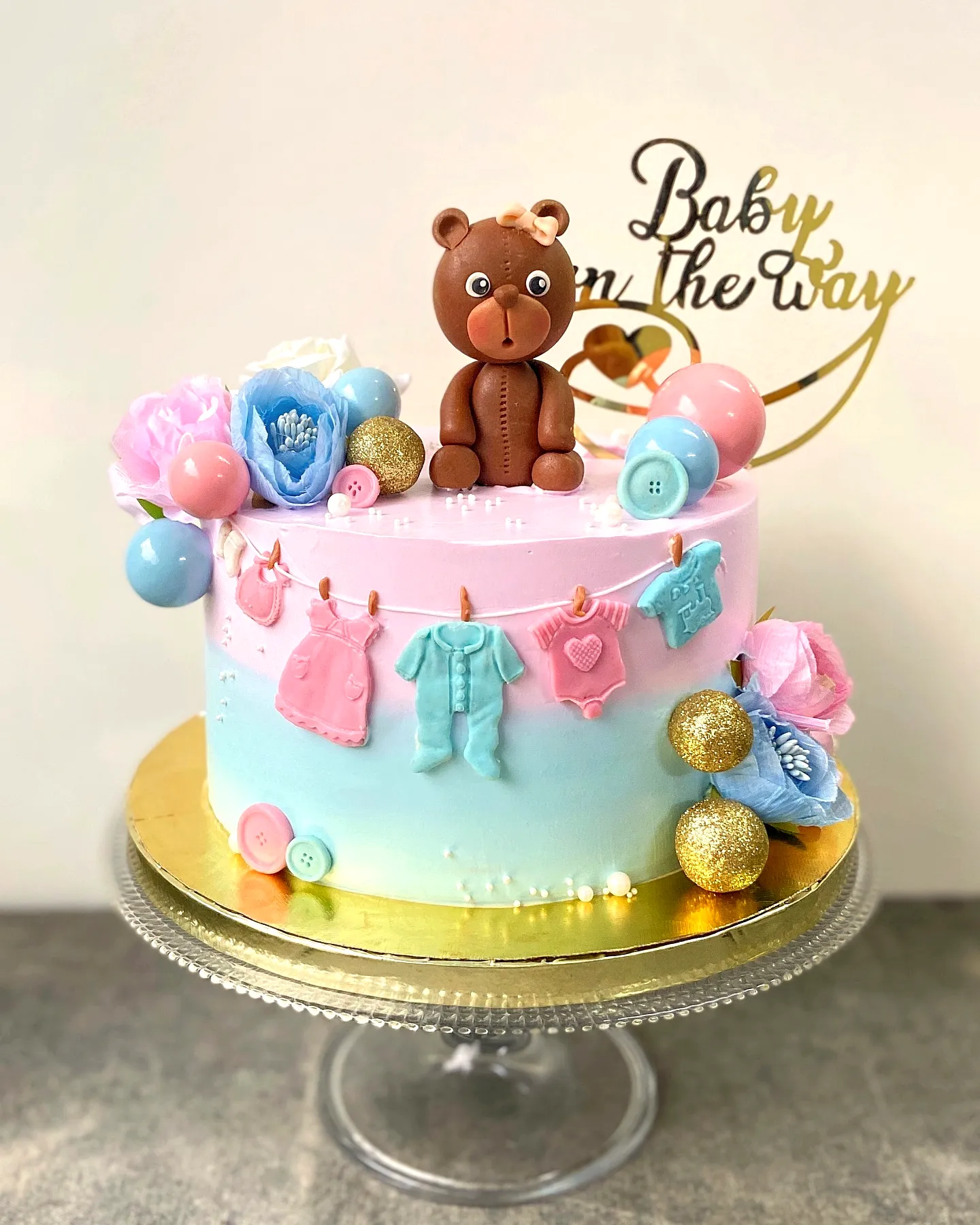 Adorable Baby Shower Cake with Pastel Ombre and Whimsical Decorations