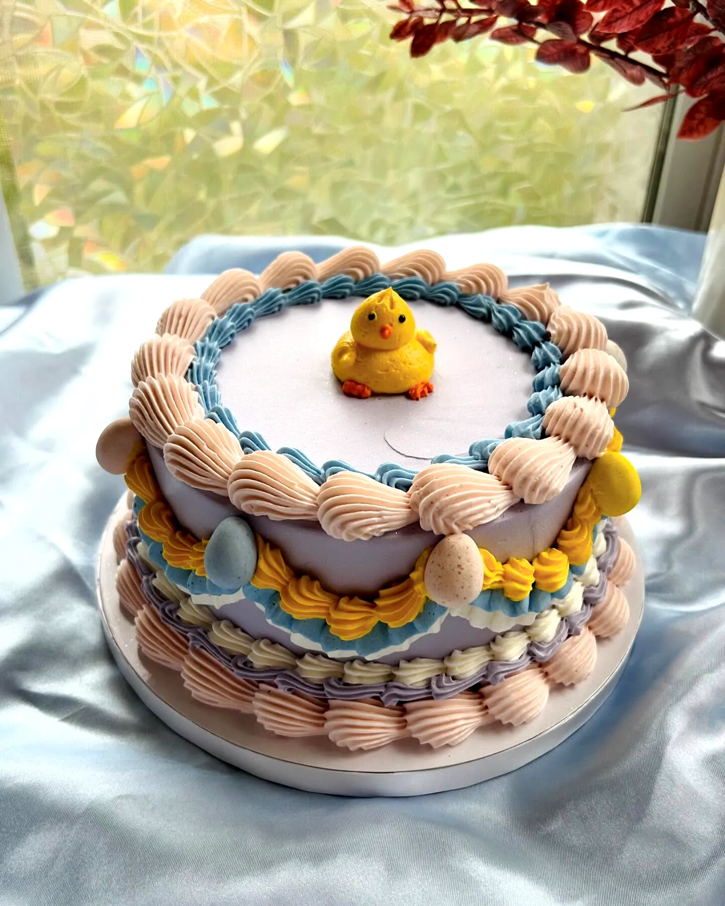 Adorable Buttercream Easter Cake in Pastel Colors with Whimsical Design