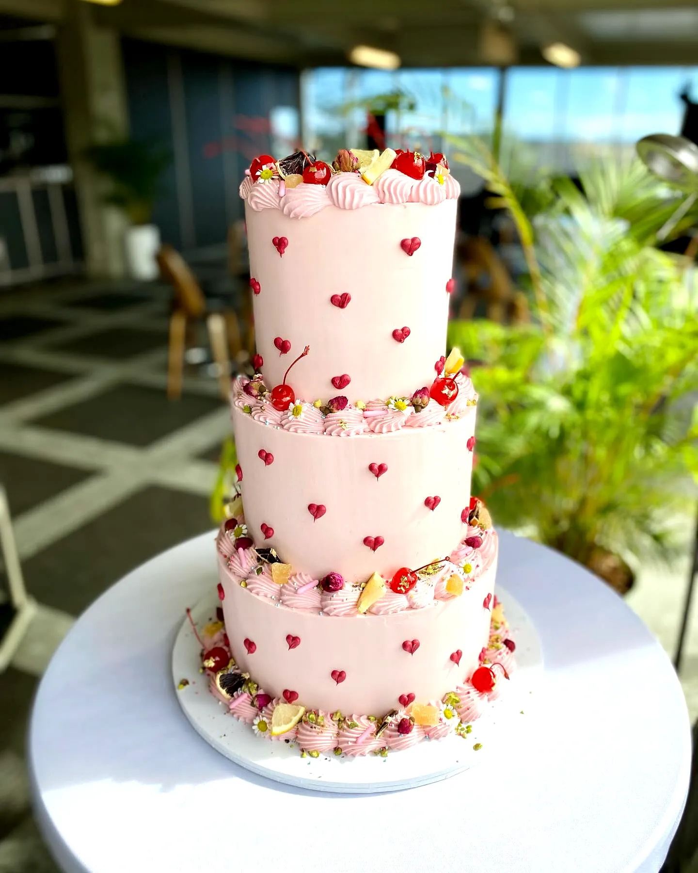 Adorable Contemporary Wedding Cake Design with Pink Buttercream and Fresh Fruit