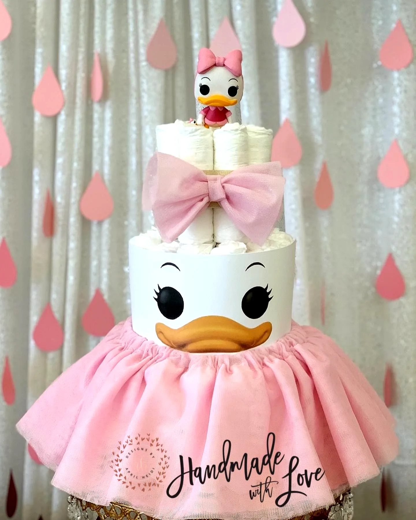 Adorable Diaper Cake Design in Playful Character Style with Pink Bow