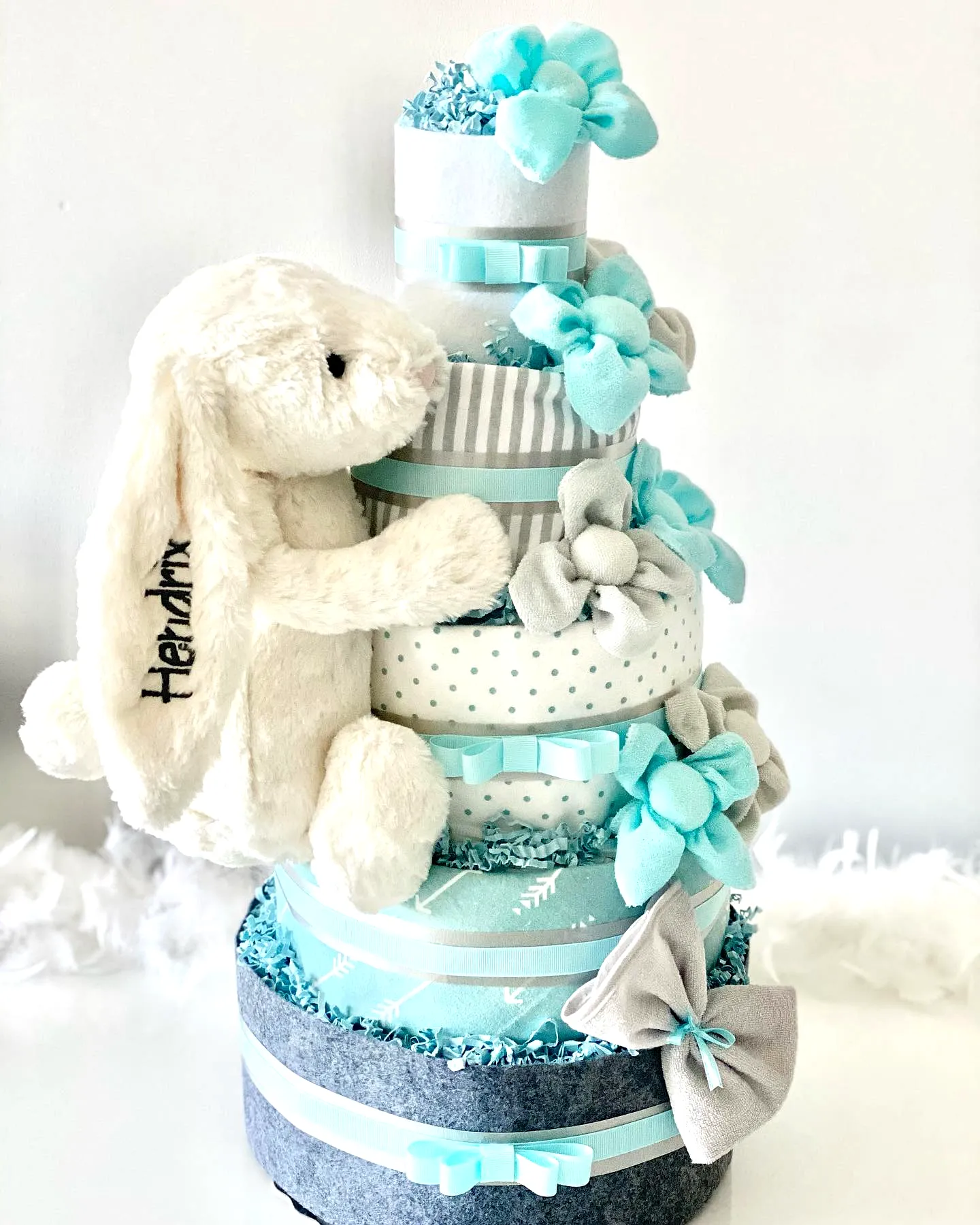 Adorable Diaper Cake Design in Soft Pastel Colors for a Whimsical Celebration