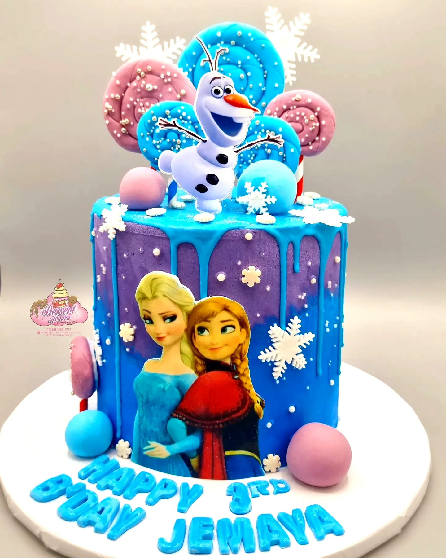 Adorable frozen birthday cake with vibrant colors and whimsical decorations