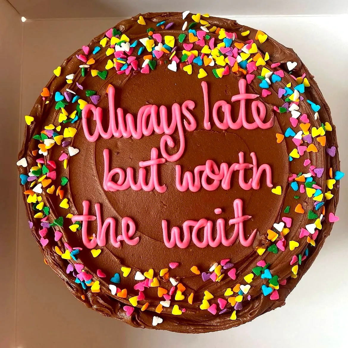 Adorable Funny Birthday Cake Featuring Colorful Heart Sprinkles and Whimsical Icing