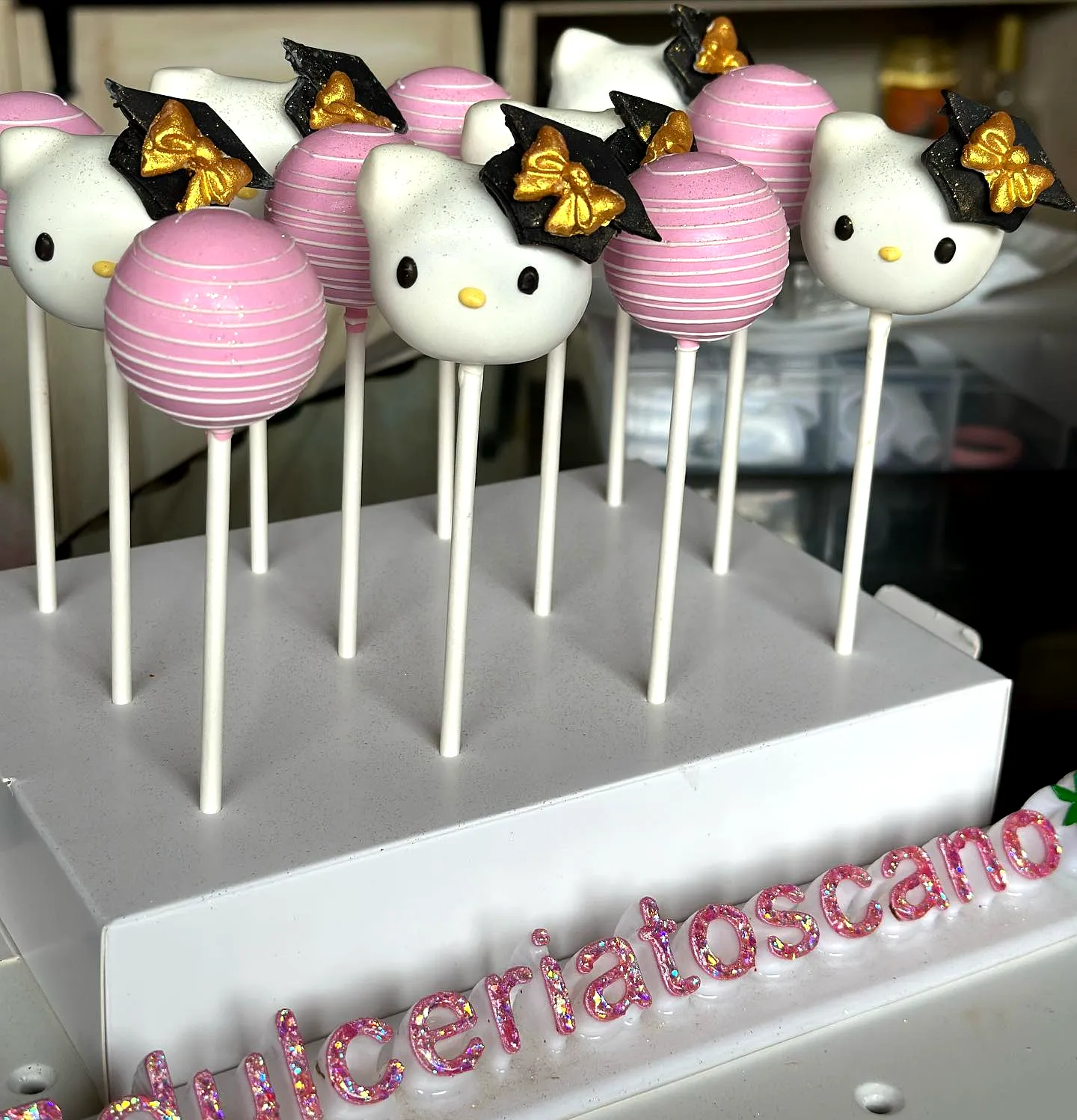 Adorable Graduation Cake Pop Design Featuring Hello Kitty Theme