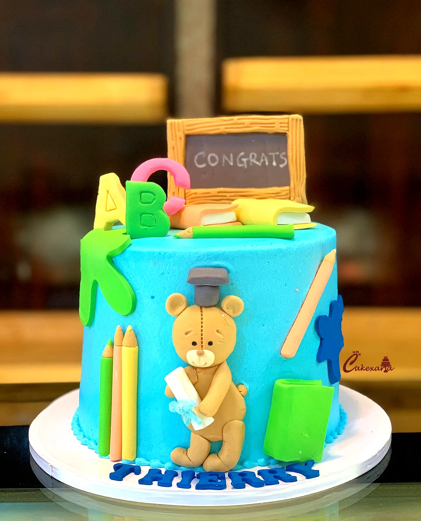 Adorable Kindergarten Graduation Cake Design with Whimsical Decorations