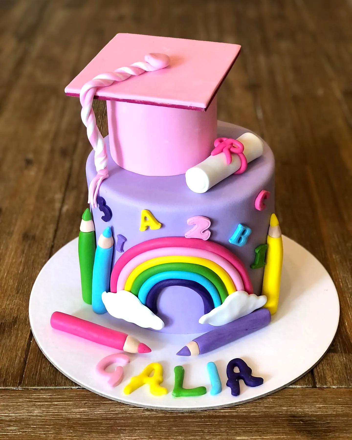 Adorable Kindergarten Graduation Cake with Whimsical Pastel Details