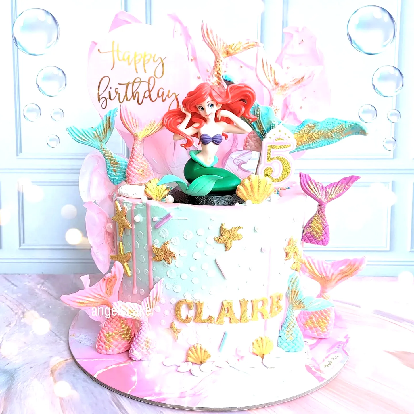 Adorable Mermaid Cake Design with Pastel Frosting and Whimsical Decorations