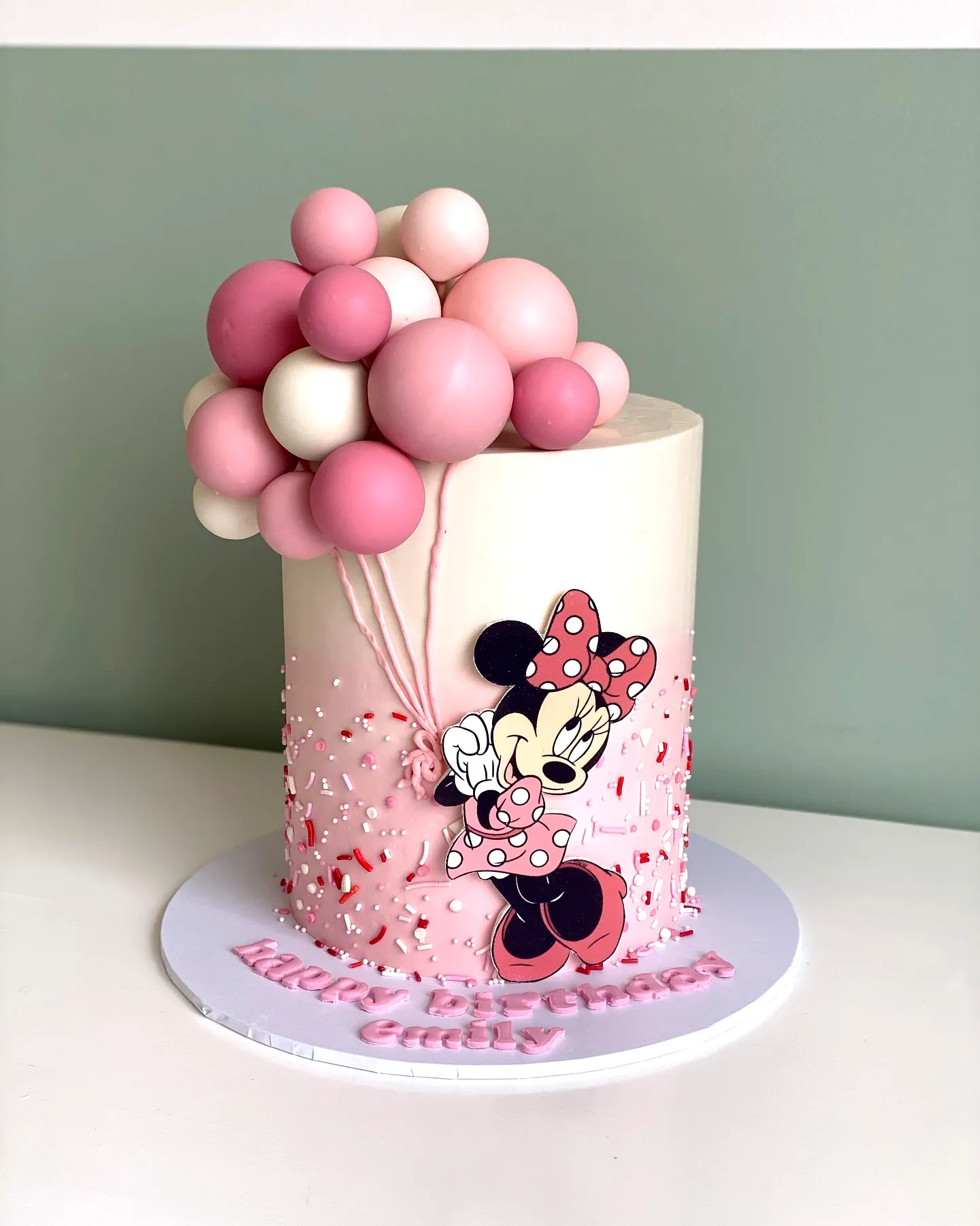 Adorable Minnie Mouse Birthday Cake Design in Playful Pink and White