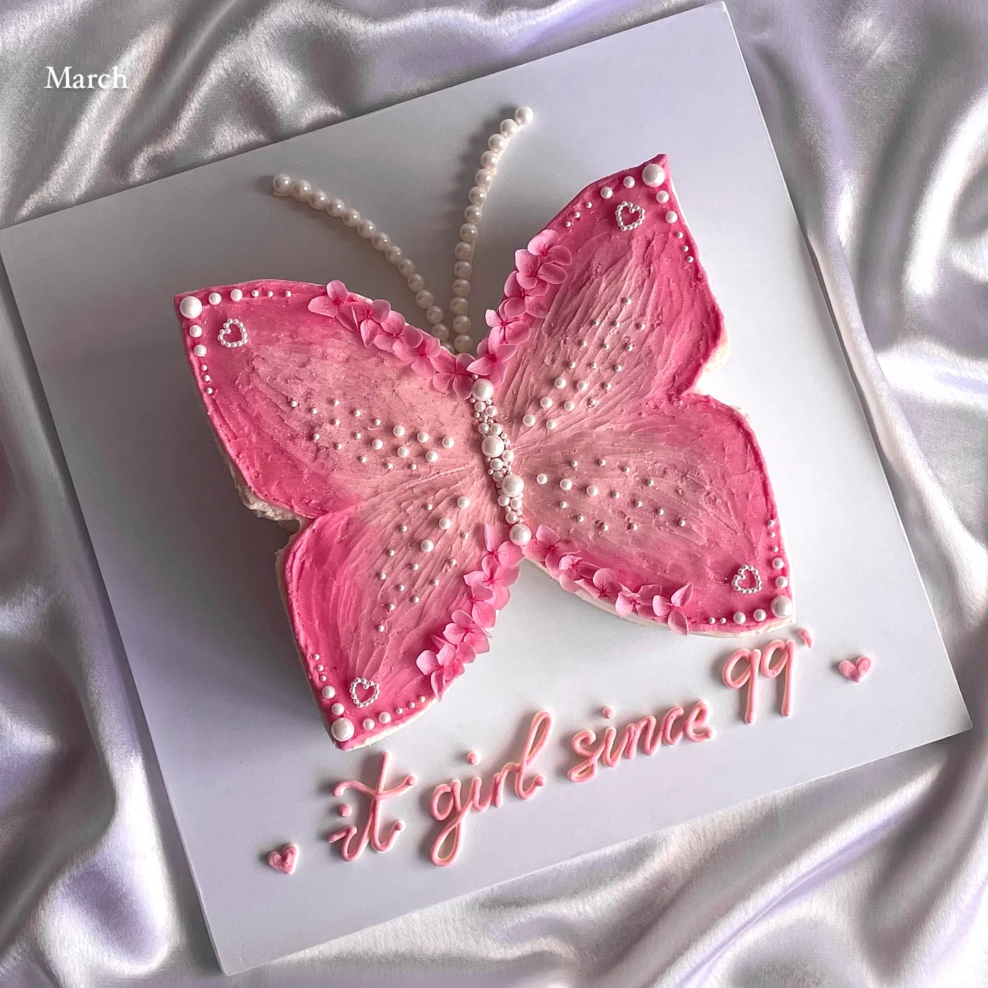 Adorable Pink Butterfly Cake Design with Elegant Frosting and Flower Decor
