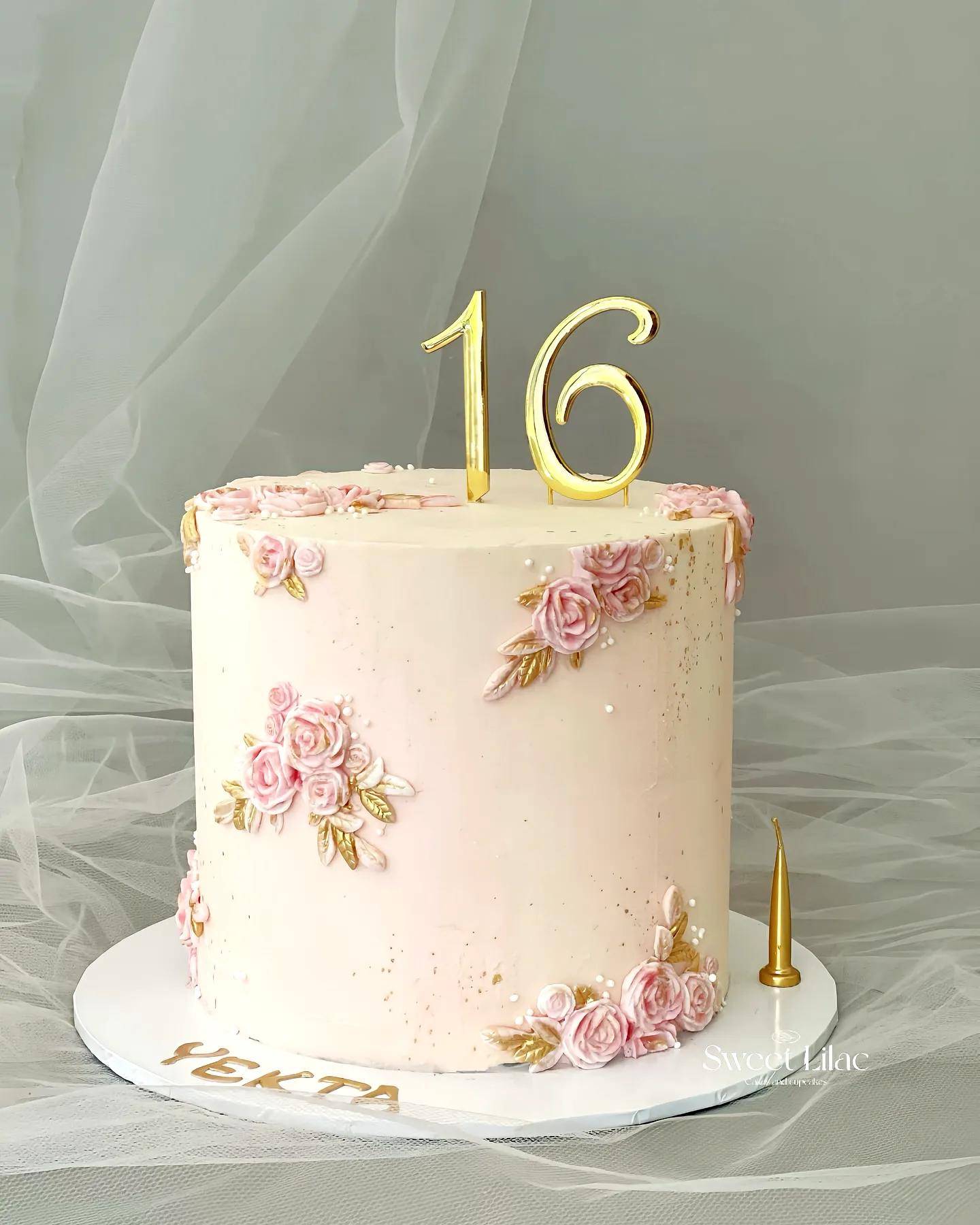 Adorable rose gold birthday cake for a sweet 16 celebration