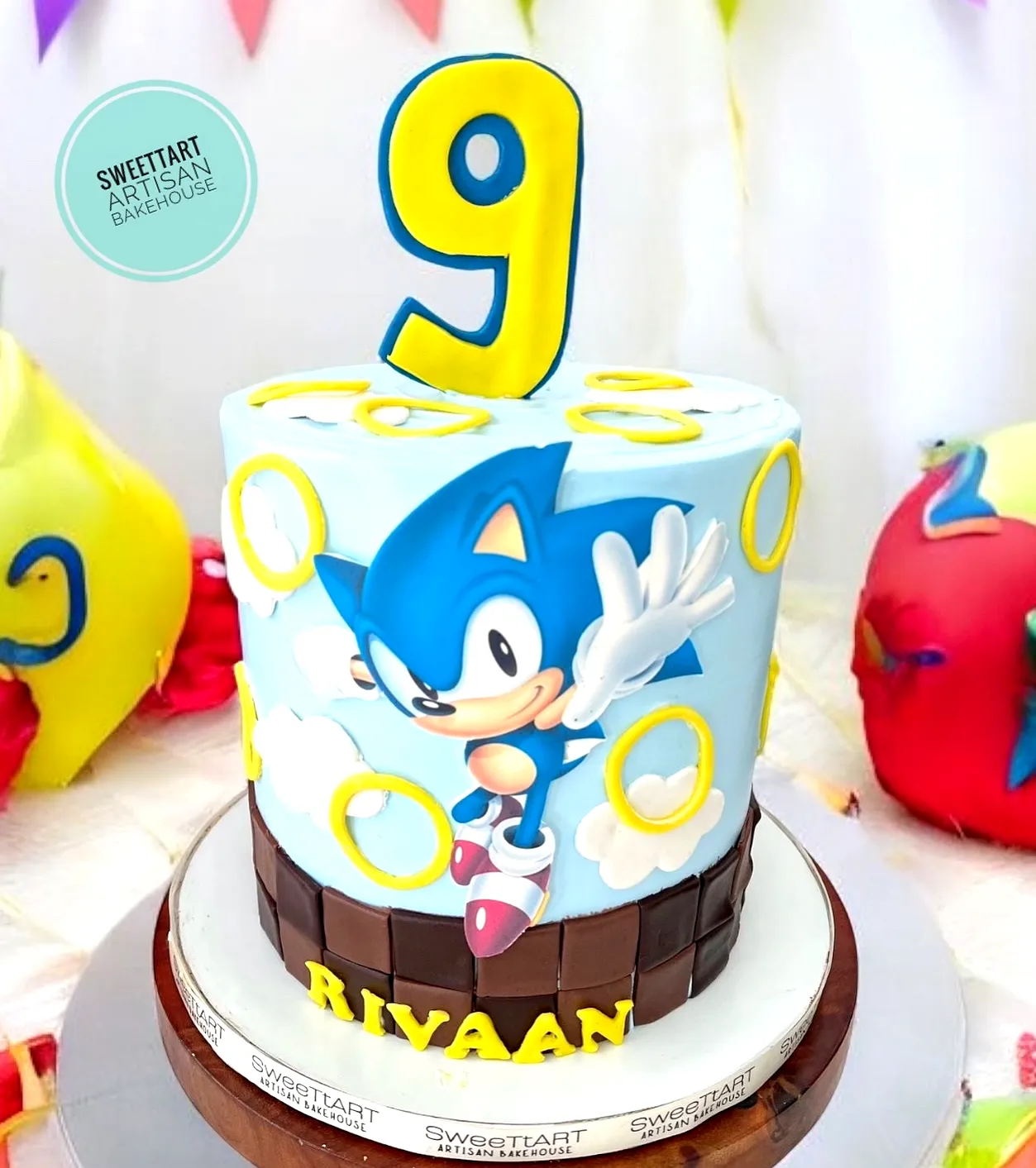 Adorable Sonic Birthday Cake with Vibrant Blue Frosting and Fun Decorations