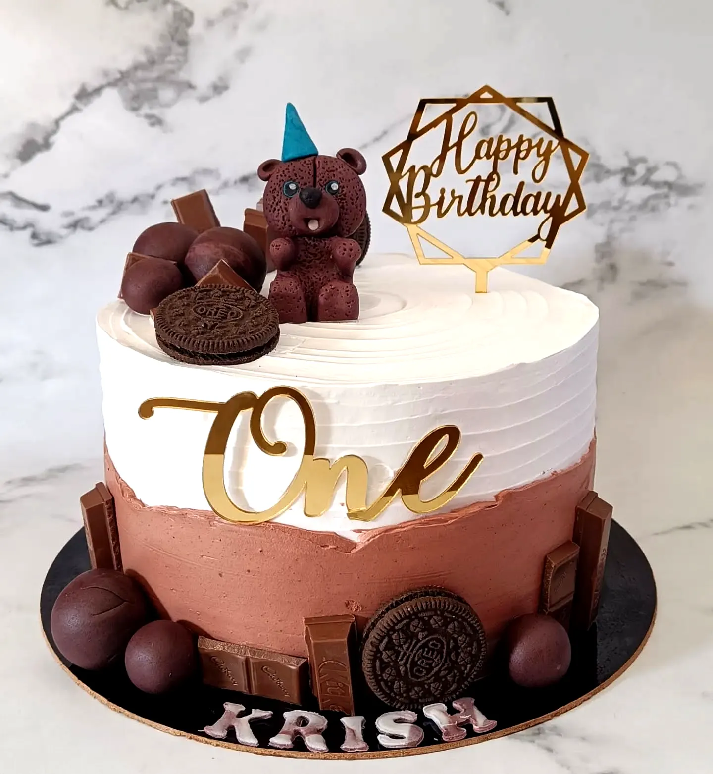 Adorable Two-Tiered Chocolate Birthday Cake Design for a First Celebration