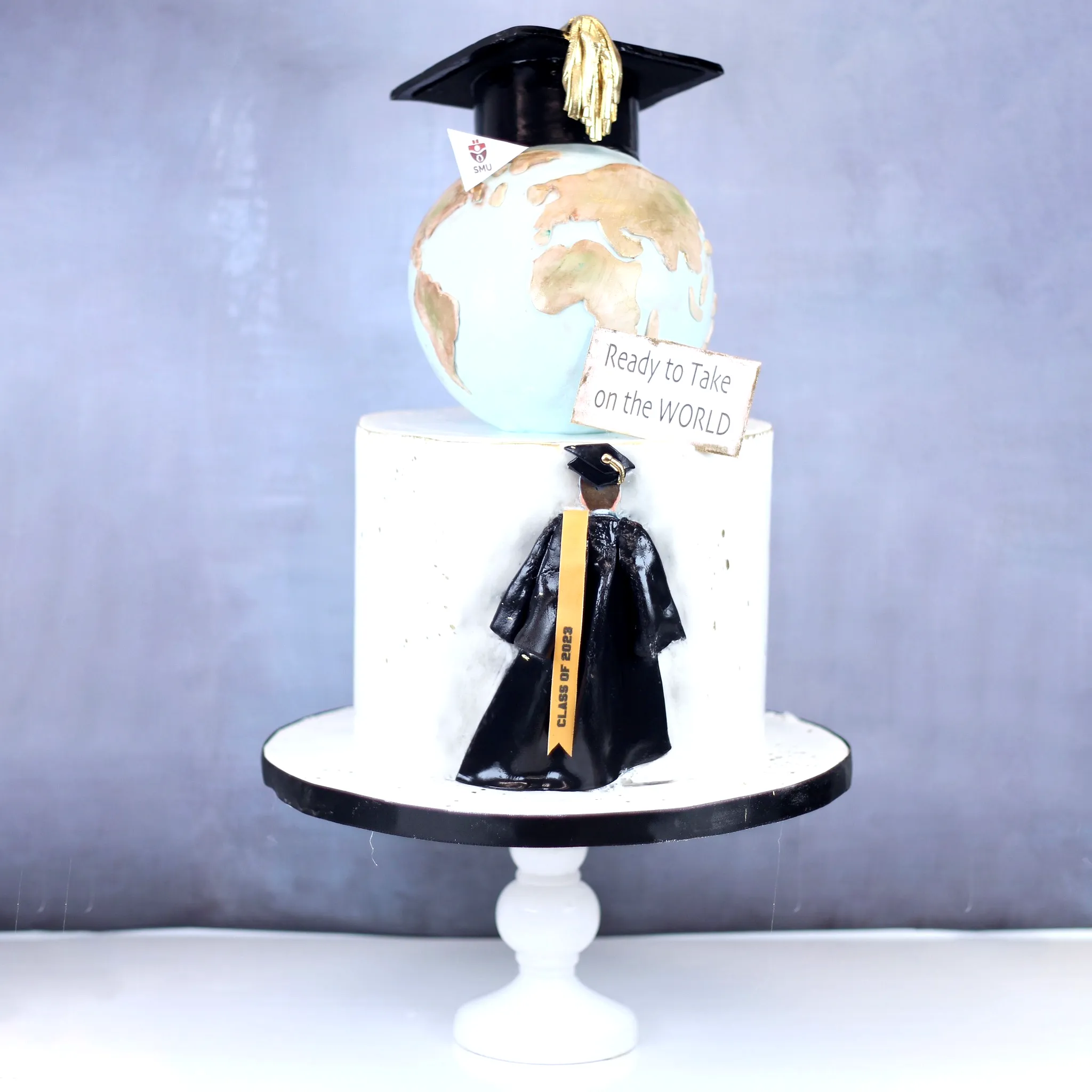 Charming Black and Gold Graduation Cake for a Memorable Celebration