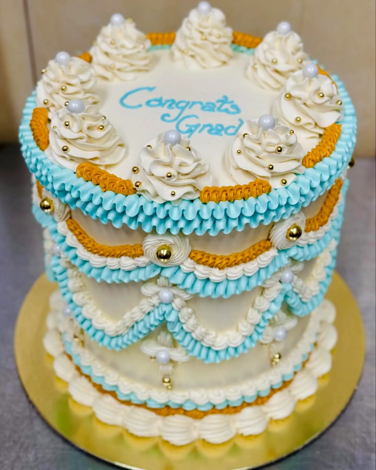 Charming Blue and Gold Graduation Cake Design for a Memorable Celebration