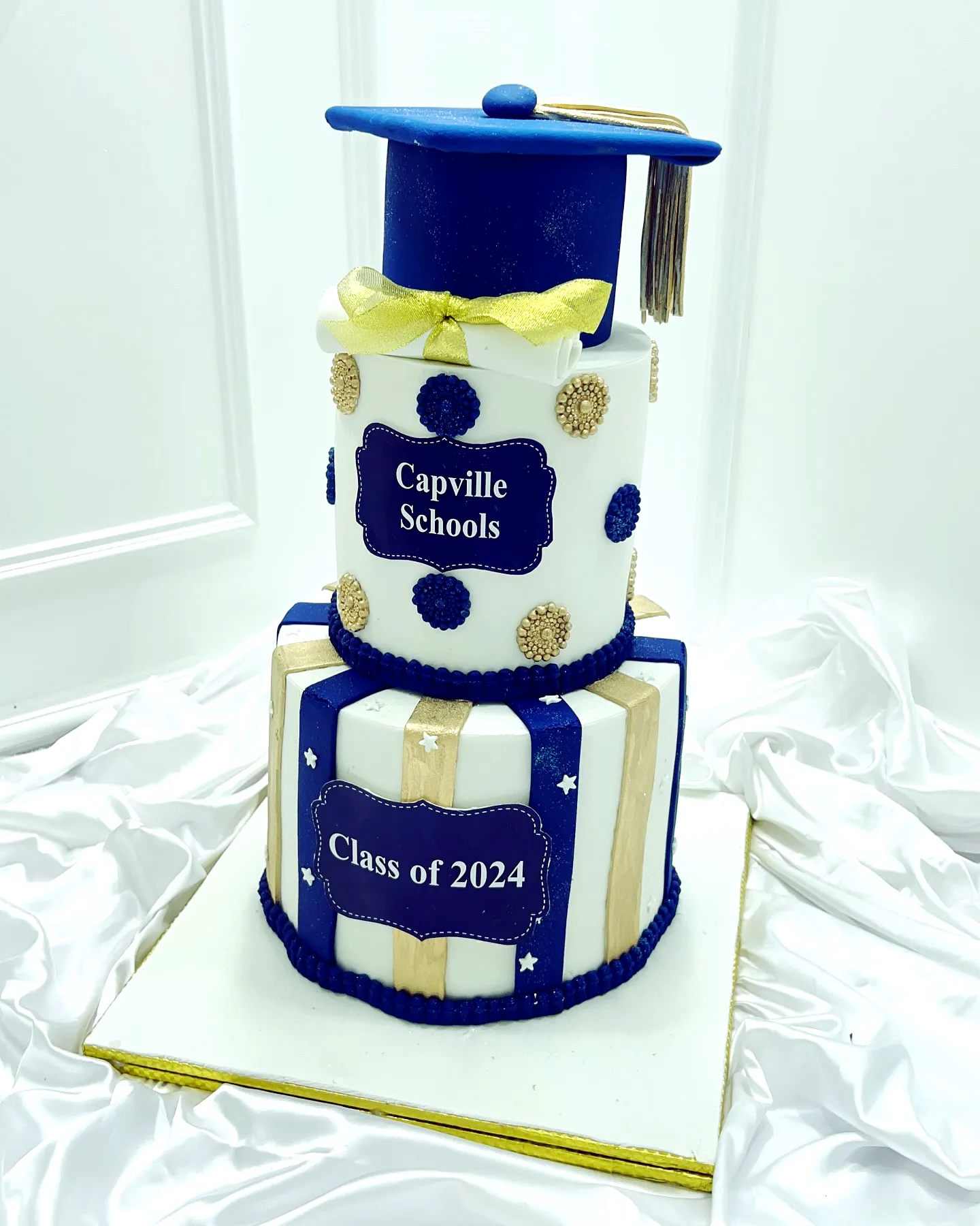 Charming Blue and Gold Graduation Cake for Celebrating Achievements