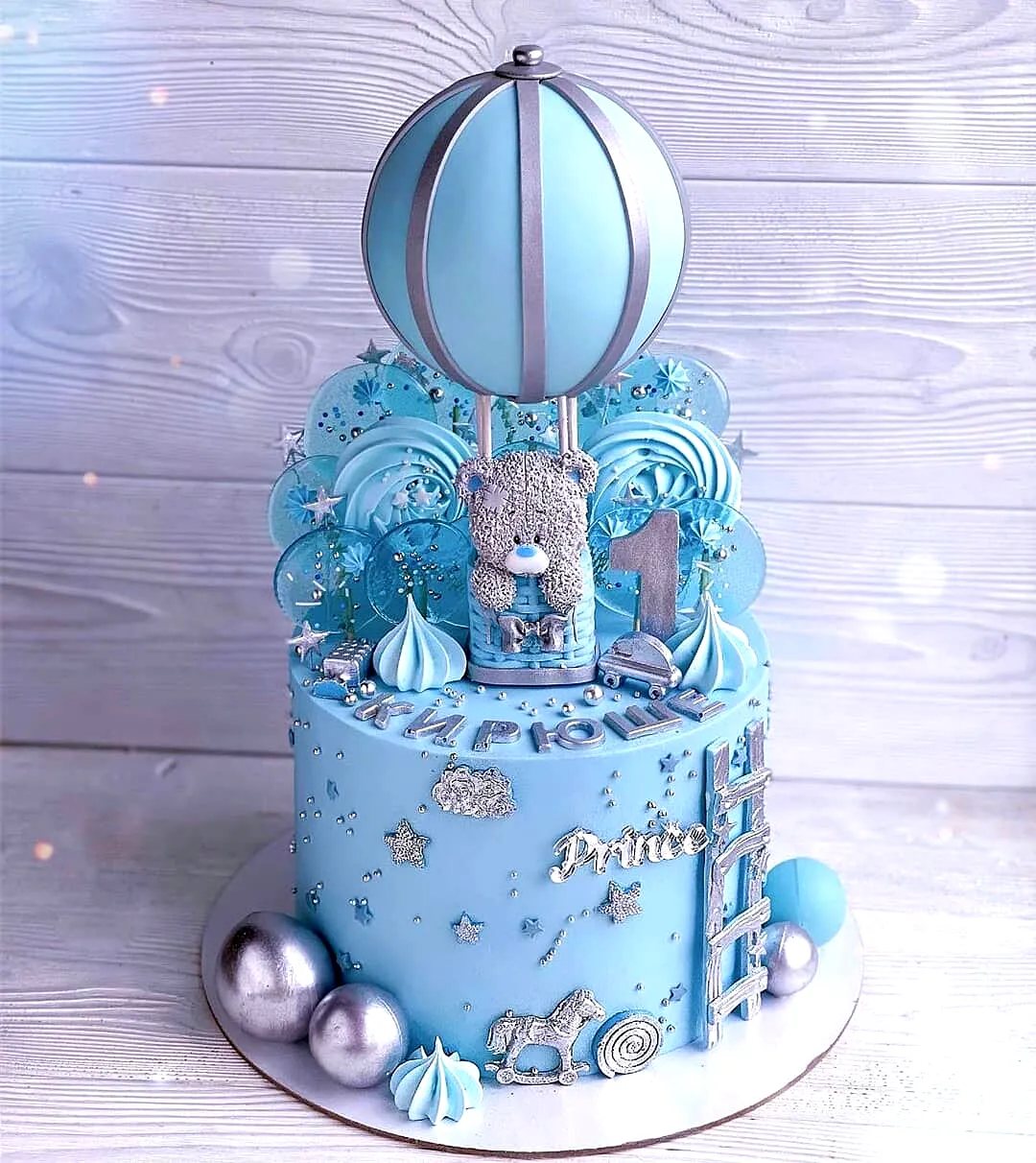 Charming Blue Birthday Cake Design with Whimsical Elements and Fun Accents