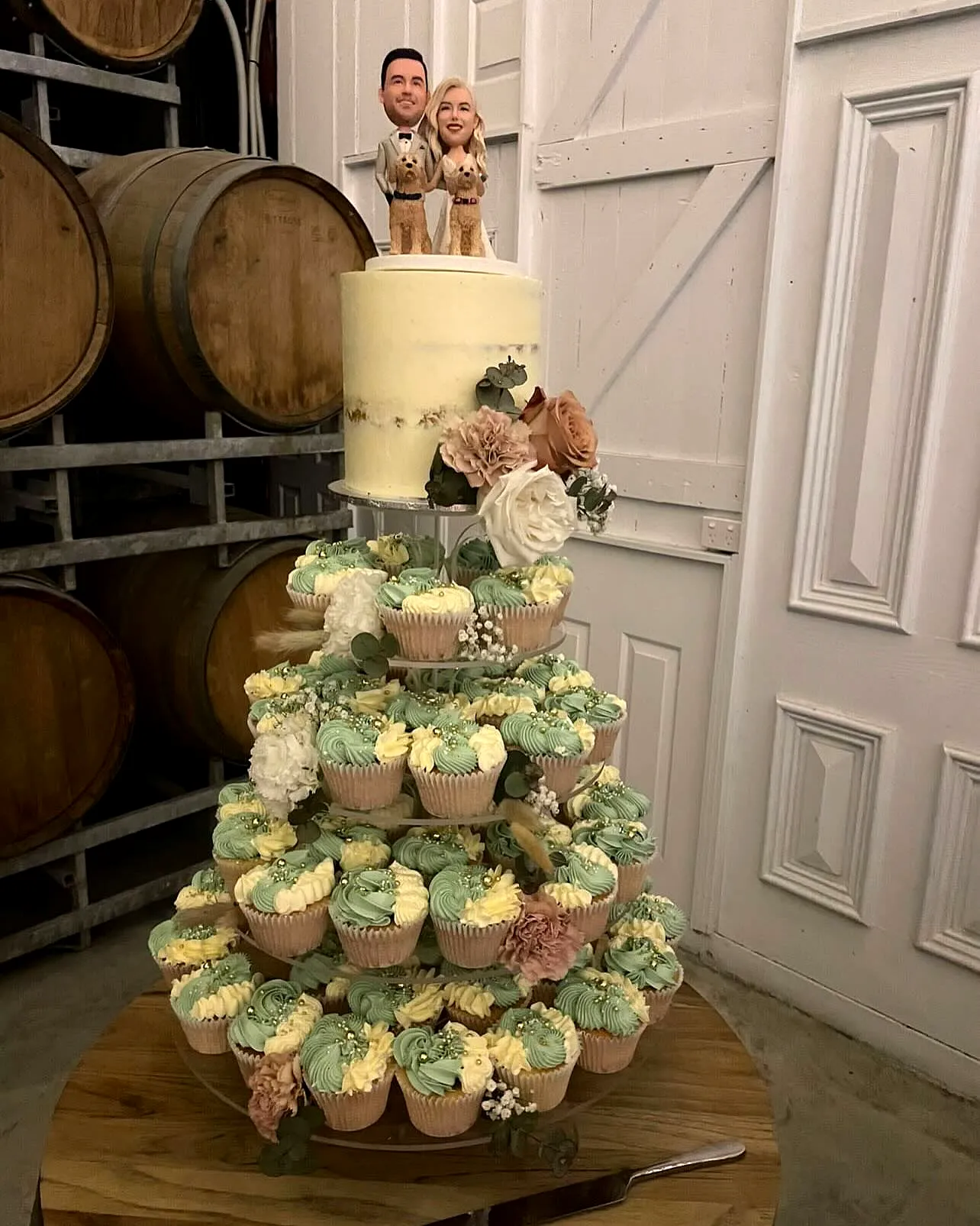 Charming Cupcake Wedding Cake Design with Pastel Colors and Whimsical Decor