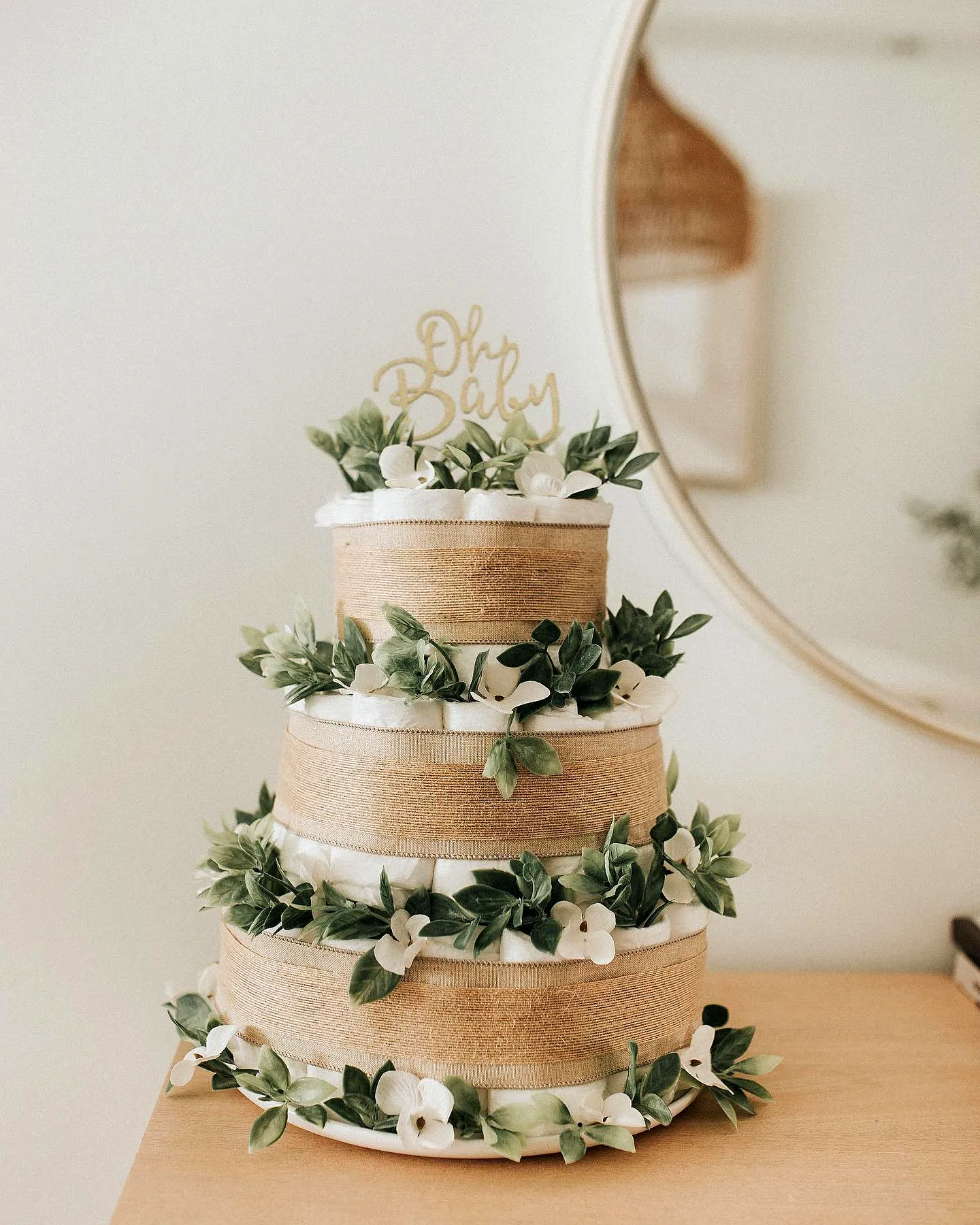 Charming Diaper Cake Design with Rustic Elegance and Delicate Decorations