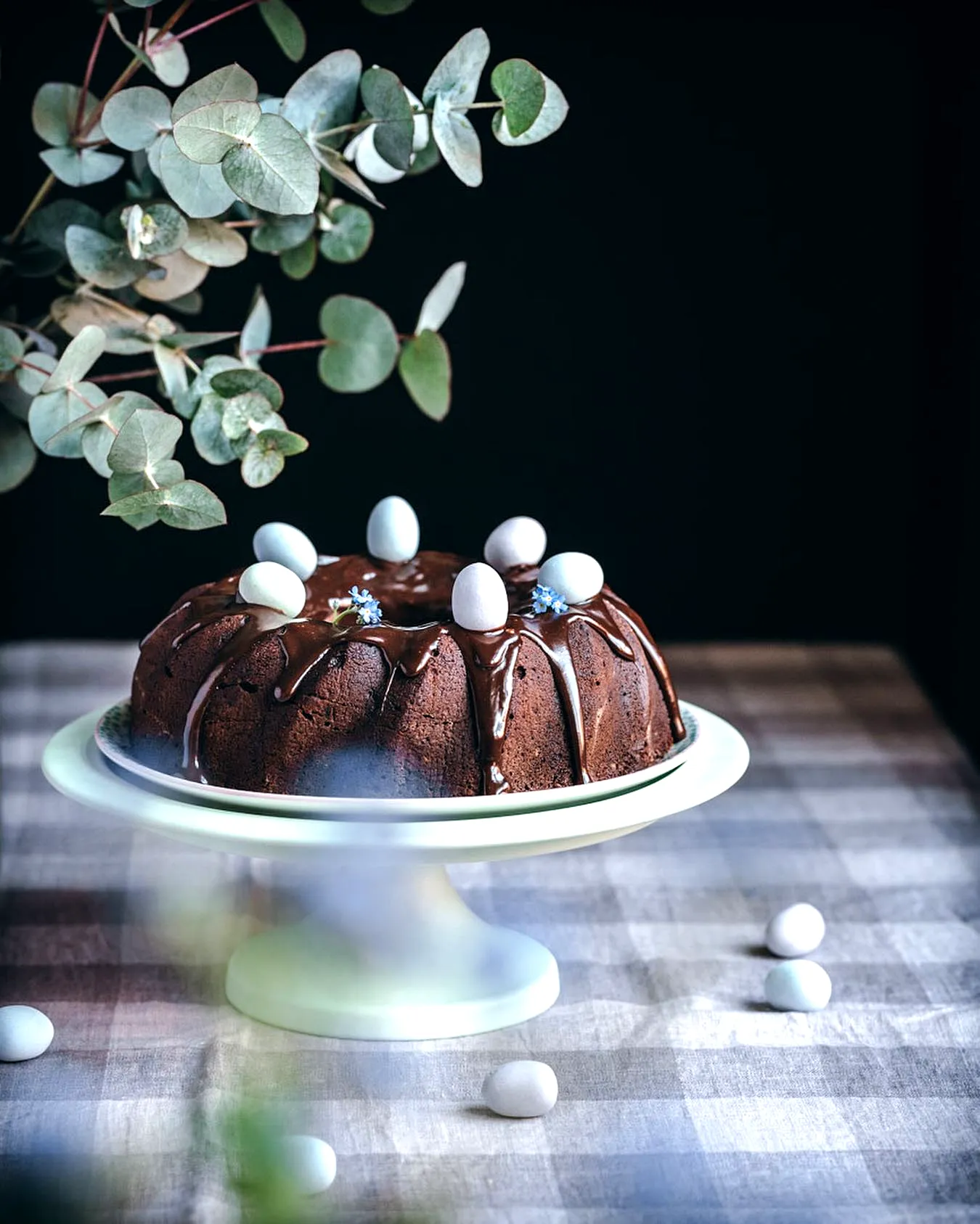 Charming Easter Bundt Cake with Chocolate Ganache and Pastel Egg Decor