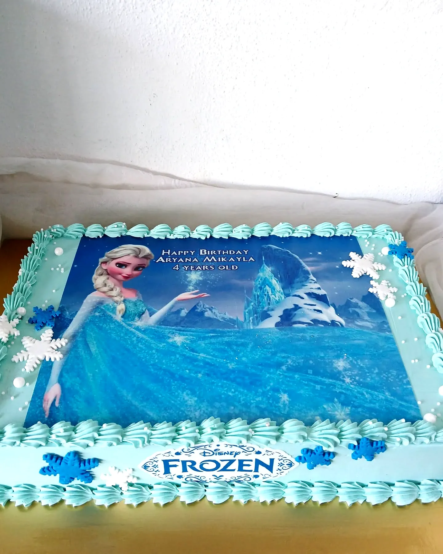 Charming Frozen Birthday Cake with Delightful Colors and Elegant Decorations
