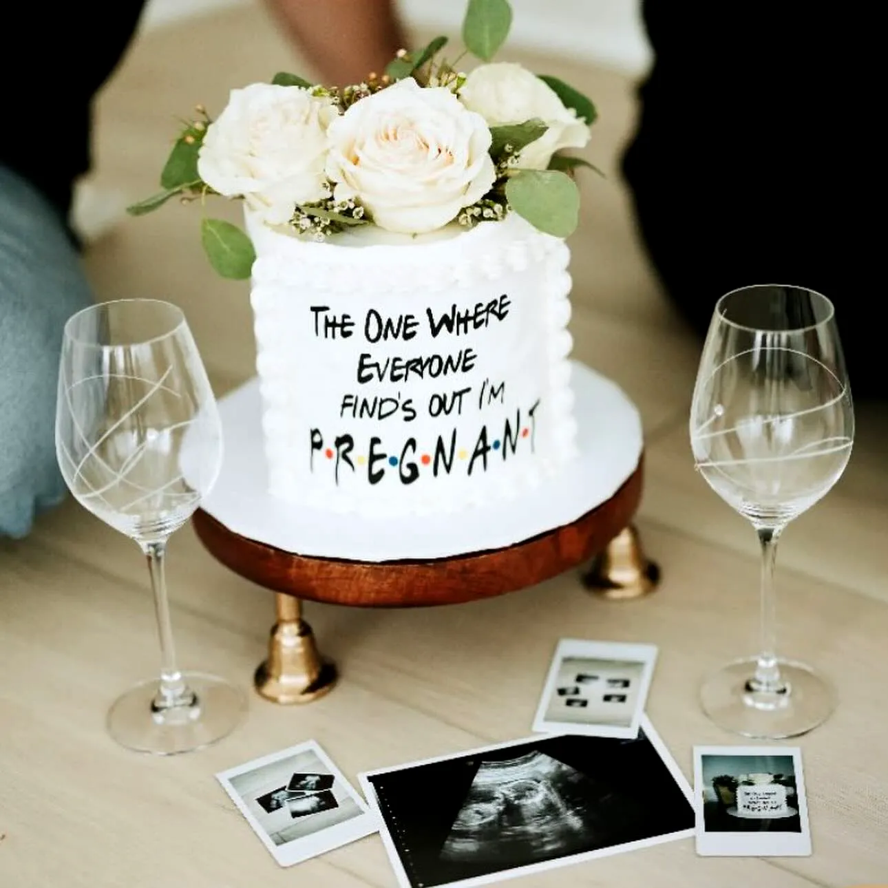 Charming Gender Reveal Cake with Whimsical Ruffled Frosting and Fresh Flowers