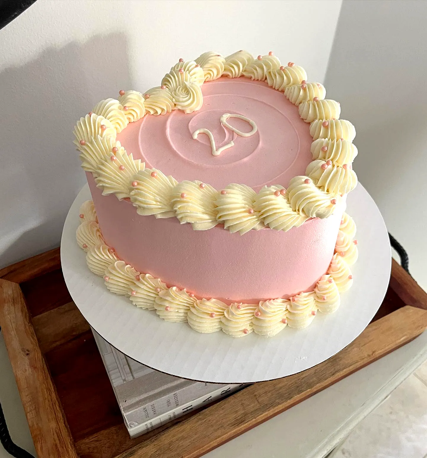 Charming Heart-Shaped 20th Birthday Cake with Pastel Pink Buttercream