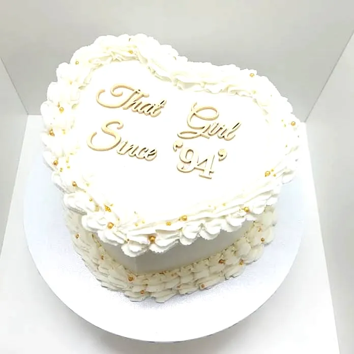 Charming Heart-Shaped 30th Birthday Cake Design with Elegant Buttercream