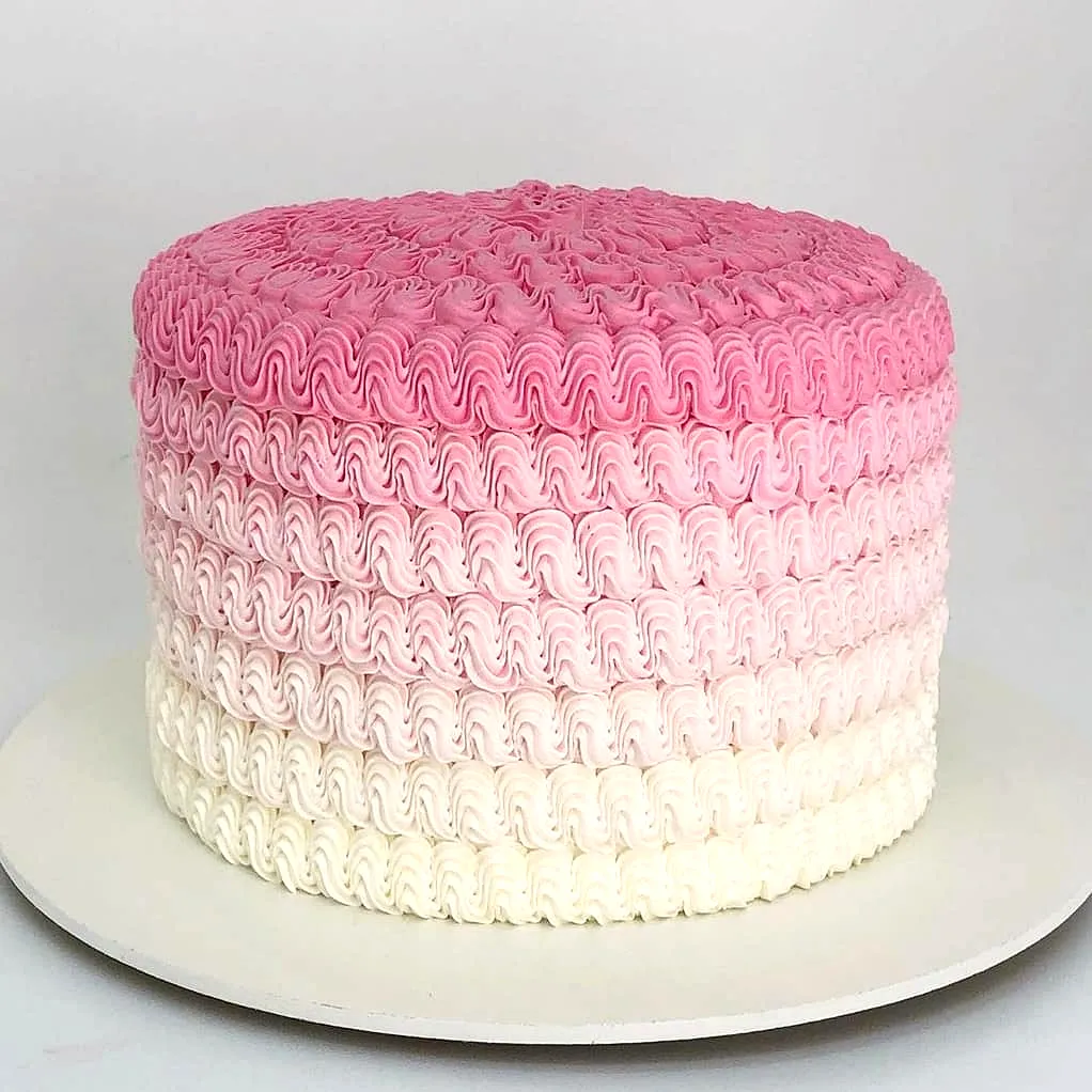 Charming Pink Birthday Cake Design with Ombre Ruffles and Elegant Texture