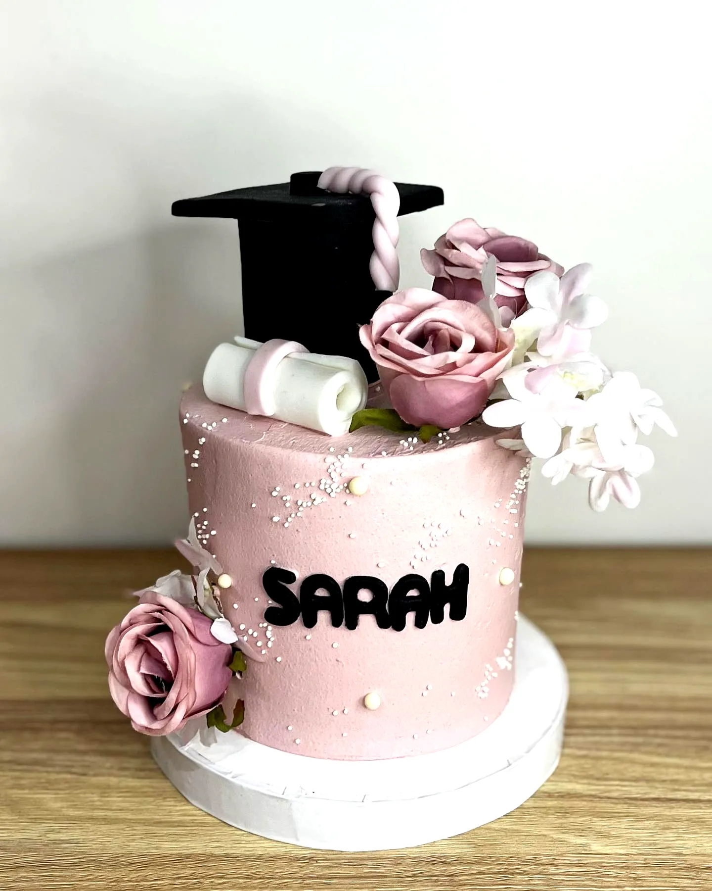 Charming Pink College Graduation Cake Perfect for Celebrating Success