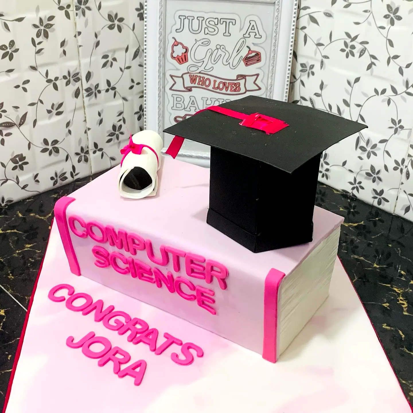 Charming Pink Graduation Cake for a Creative Celebration
