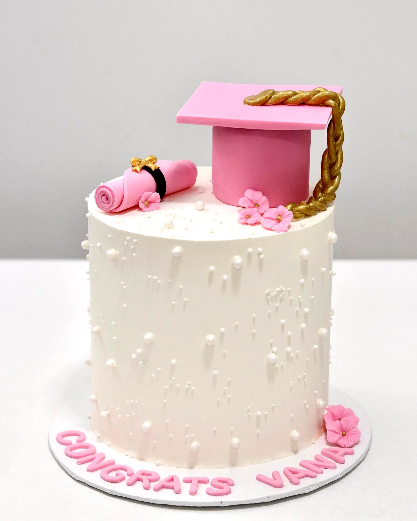 Charming Pink Graduation Cake for a Stylish Celebration