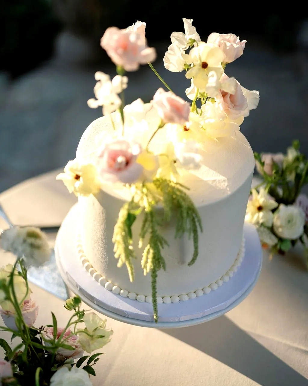 Charming Small Wedding Cake with Elegant Buttercream and Pastel Flowers