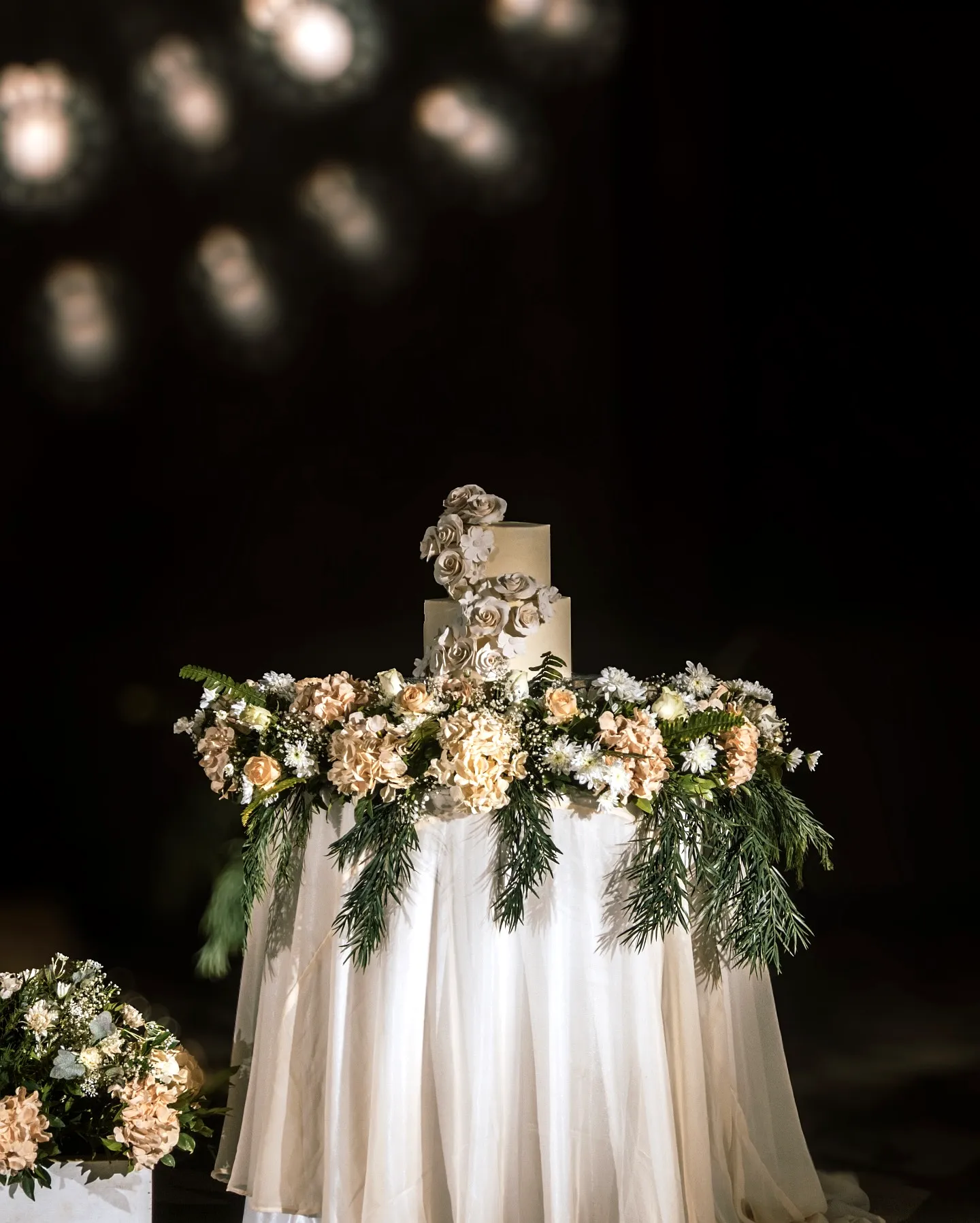 Charming Wedding Cake Table with Elegant Floral Design and Soft Tones