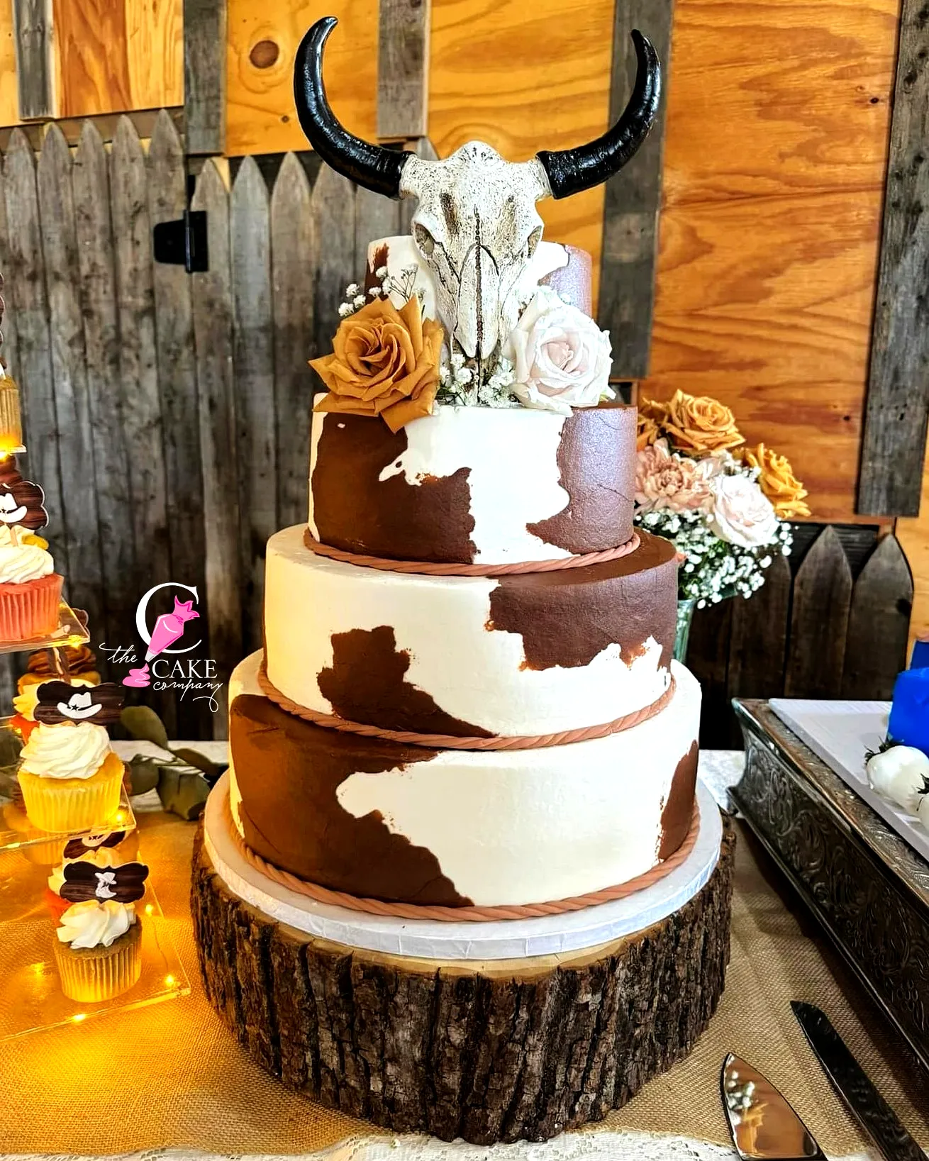 Charming Western Wedding Cake with Rustic Cowhide Design and Elegant Details