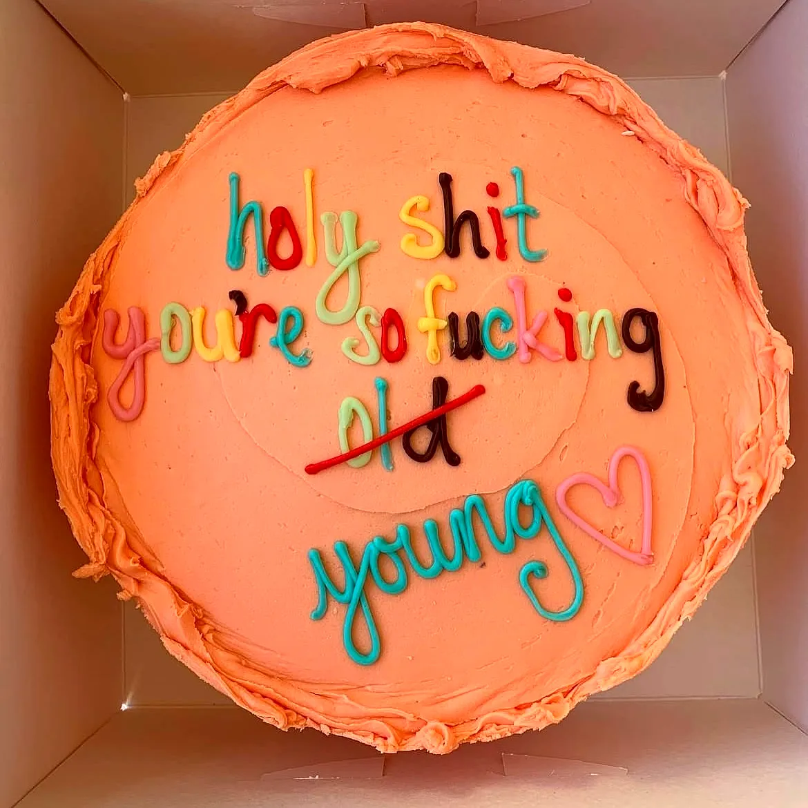 Cheeky and Colorful Funny Birthday Cake for a Playful Celebration