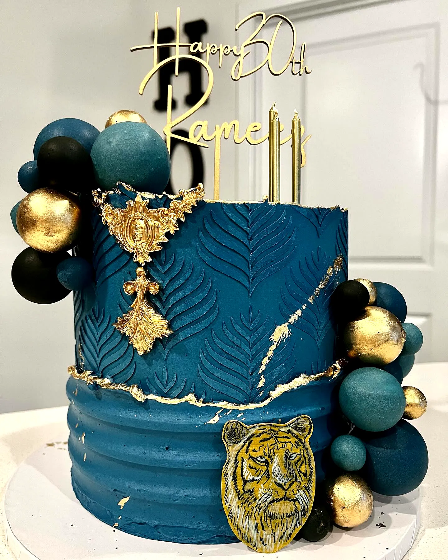 Colorful Blue and Gold Graduation Cake Design with Creative Accents