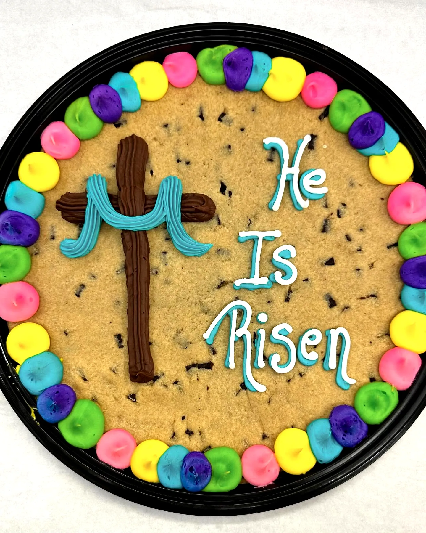Colorful Easter Cookie Cake with Fun Pastel Decorations and Chocolate Cross