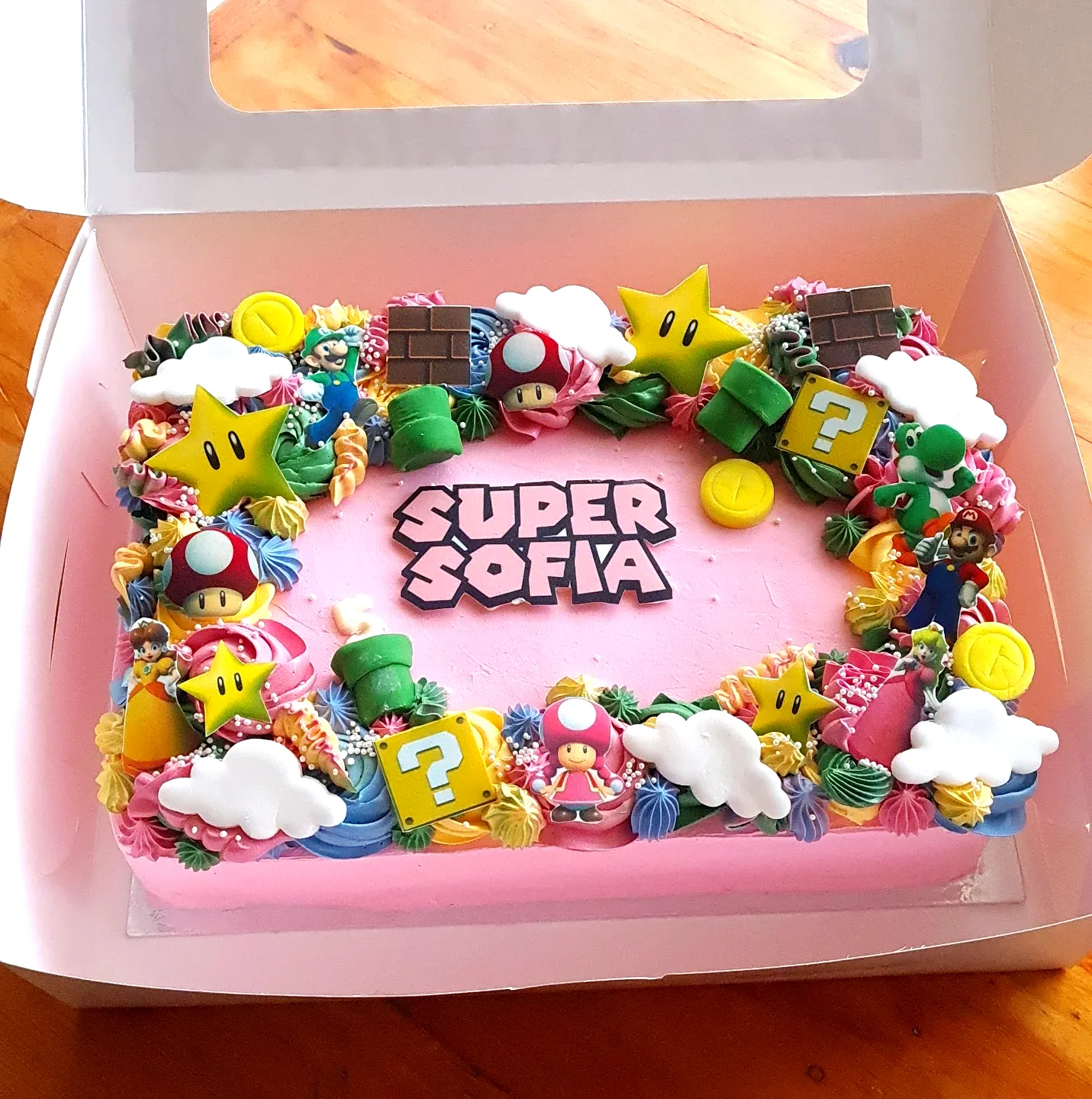 Colorful Mario Birthday Cake with Fun Decorations and Playful Design