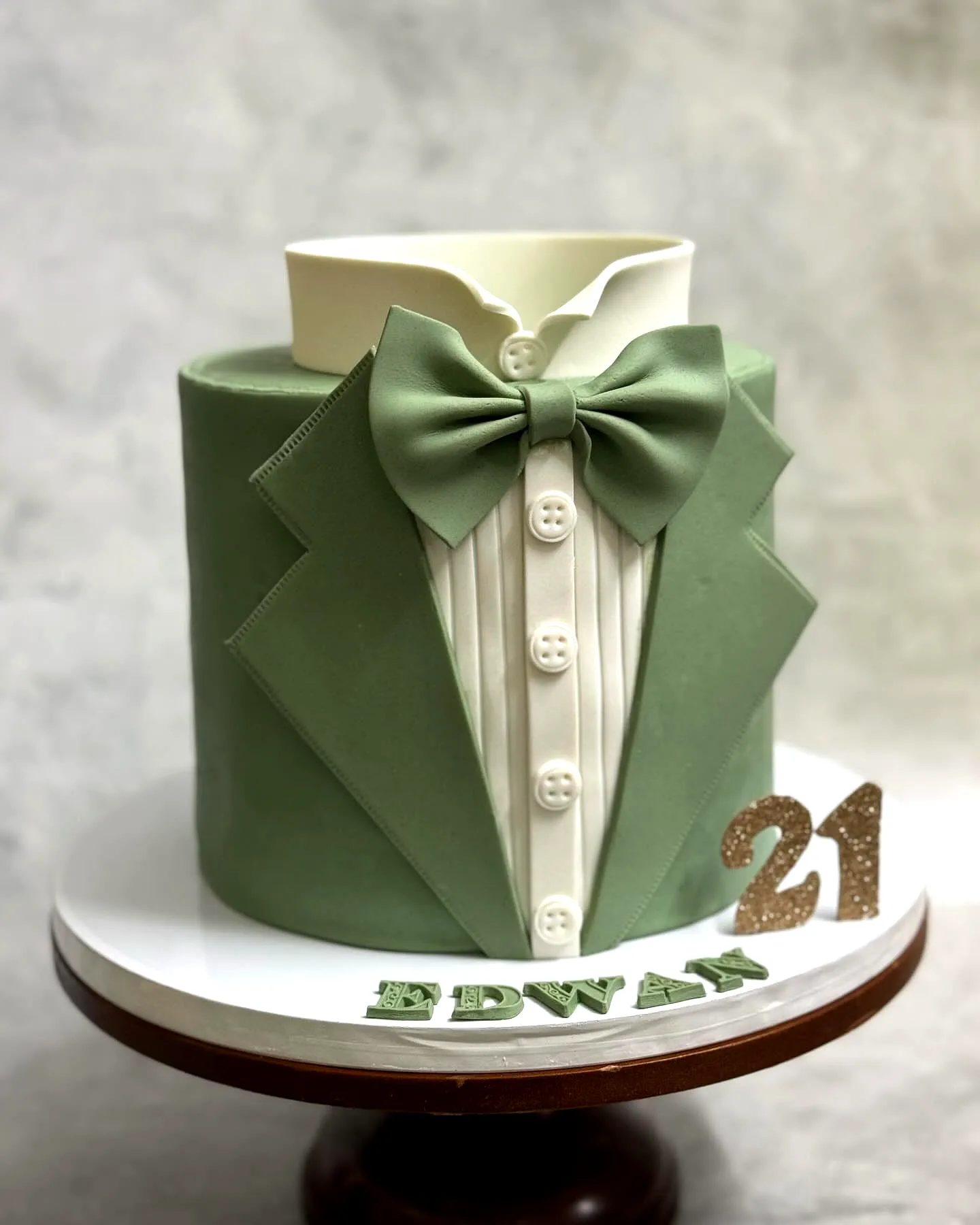 Creative 21st Birthday Cake Design with Tuxedo Theme and Green Fondant