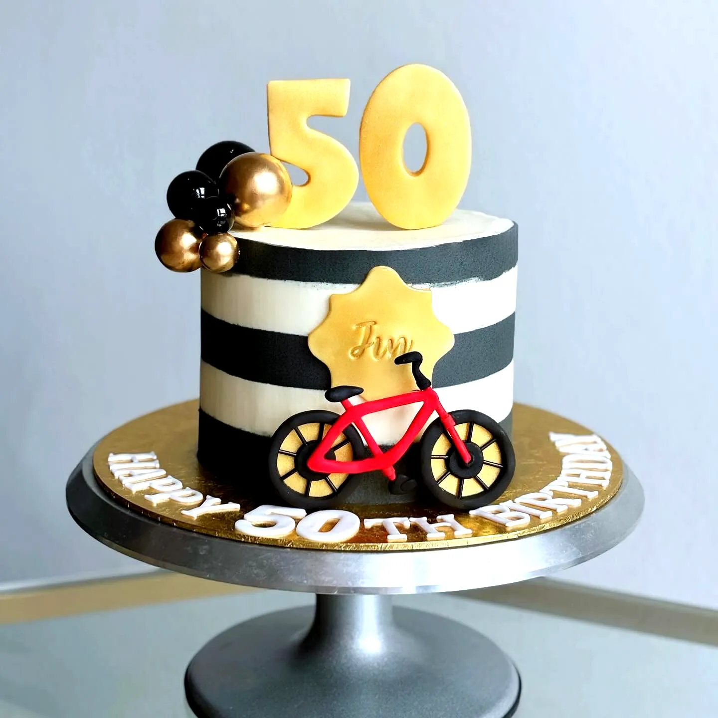 Creative 50th Birthday Cake for Men with Bold Colors and Fun Decorations