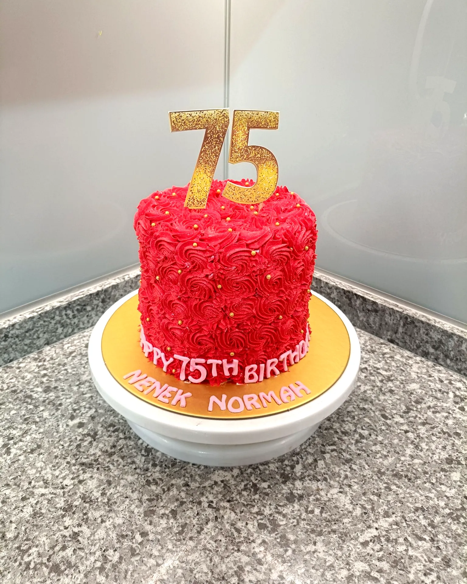 Creative 75th Birthday Cake Design in Vibrant Red with Gold Accents