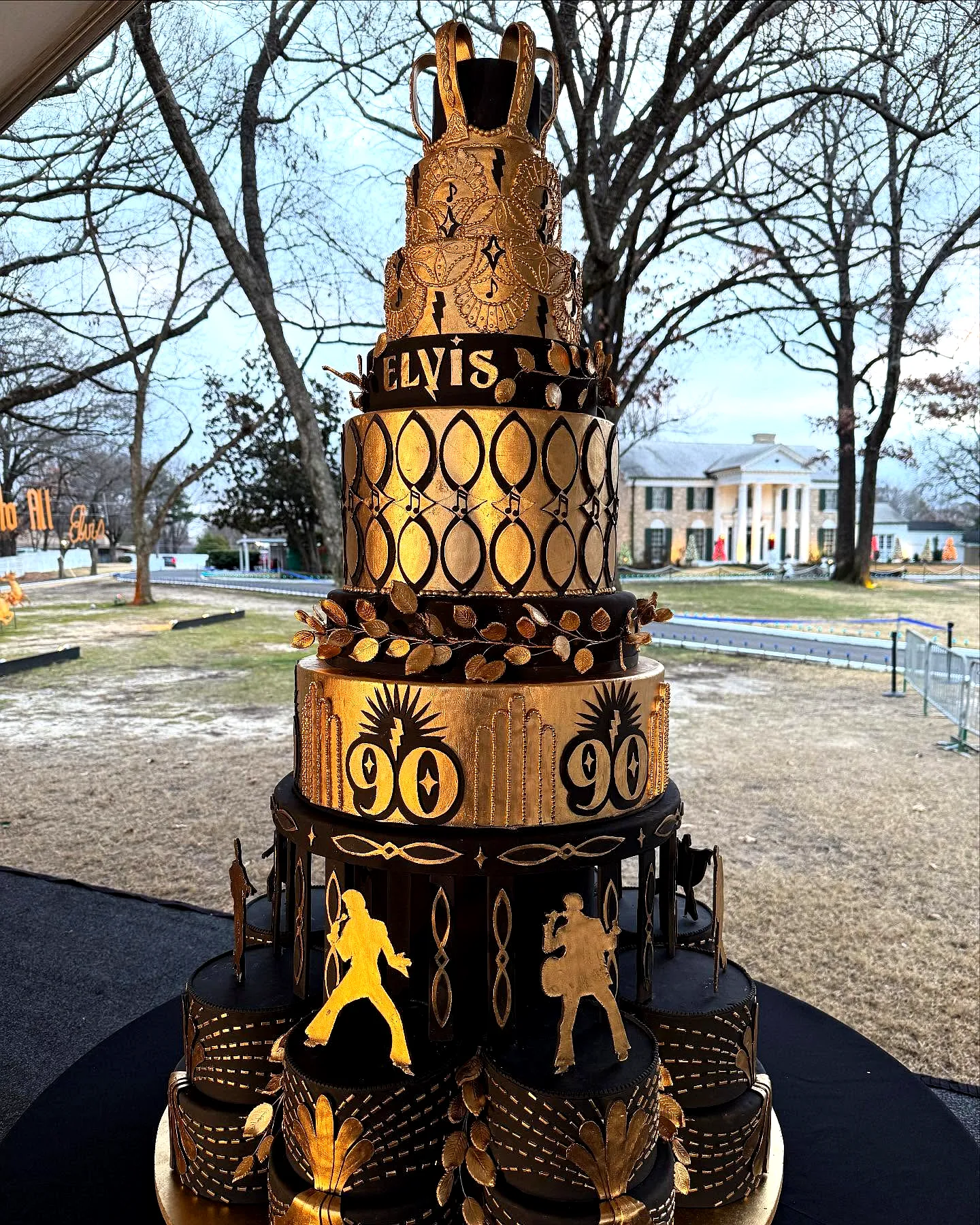 Creative 90th Birthday Cake Design in Black and Gold Celebrating Elvis