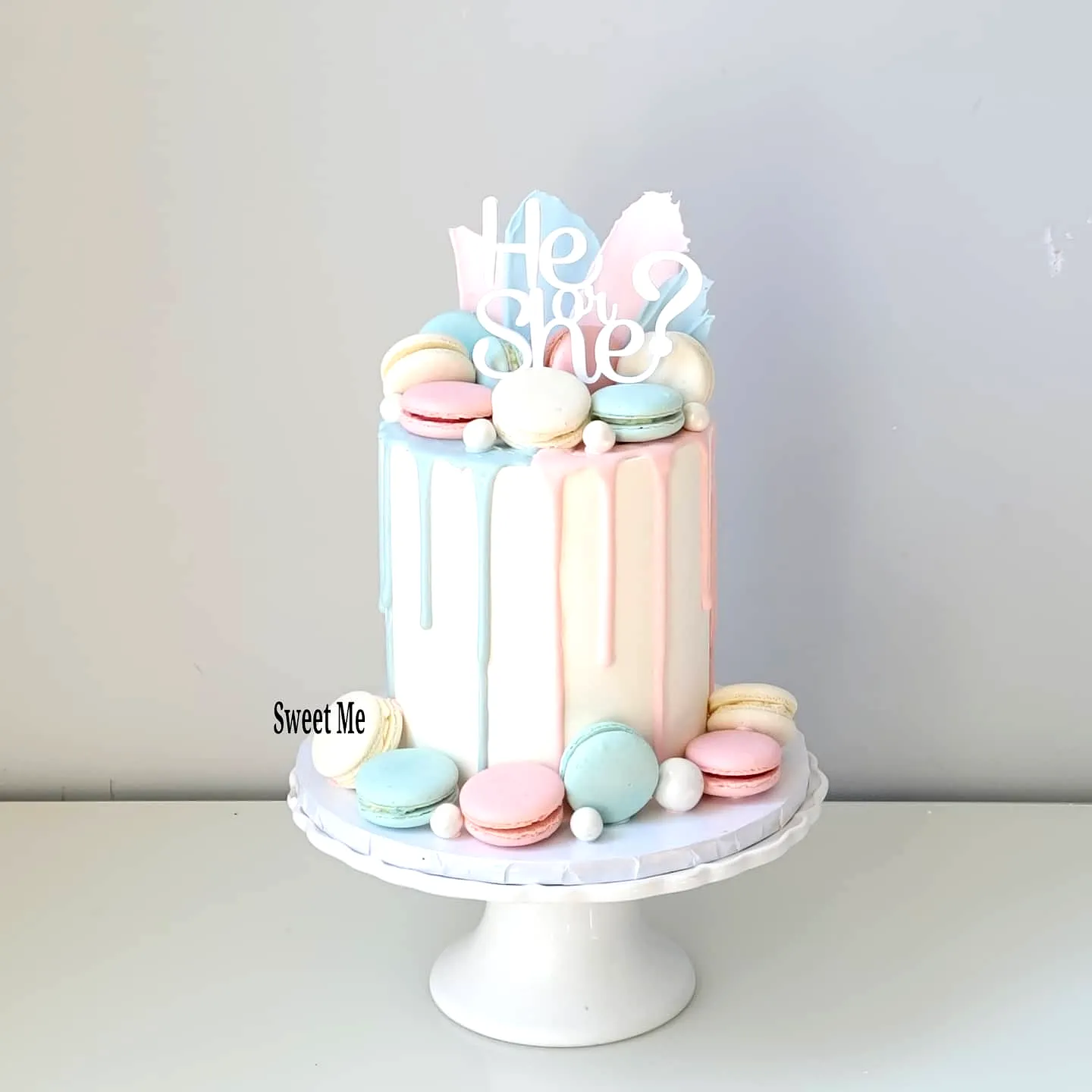 Creative baby shower cake design with pastel hues and playful decorations