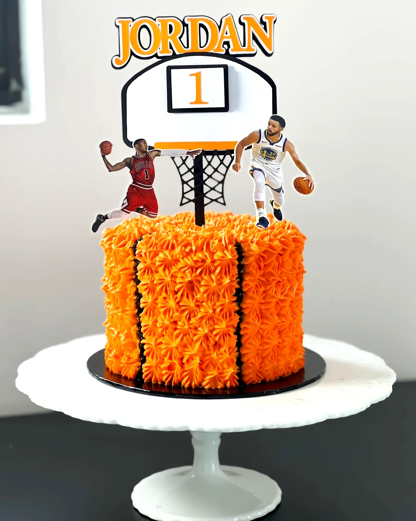 Creative basketball birthday cake design with vibrant orange frosting