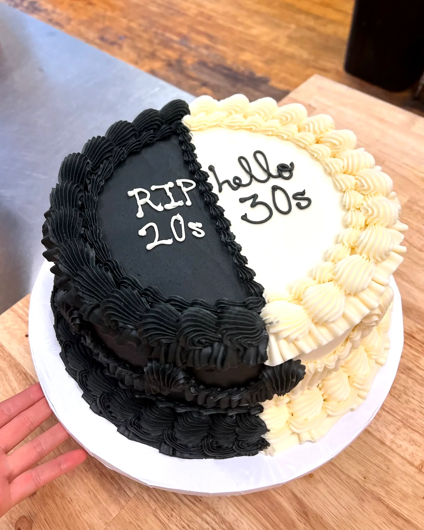 Creative birthday cake design in a stylish black and white theme